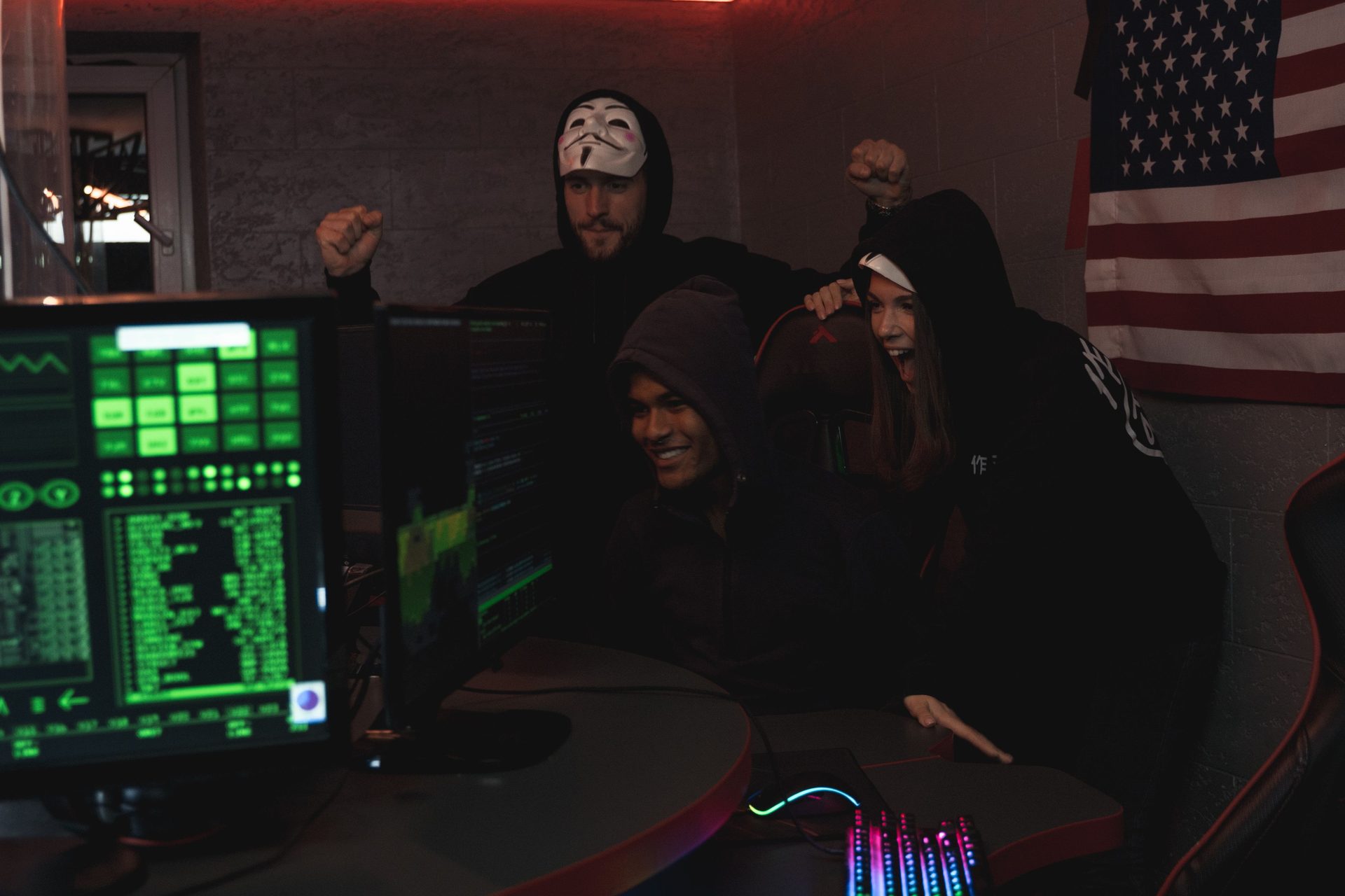 A duo bench with two side-by-side gaming stations sharing warm garland light